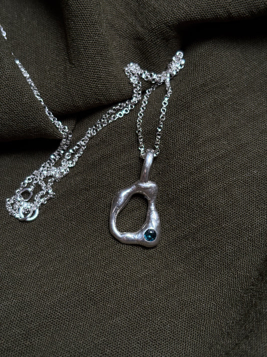 Molten pendant with sapphire