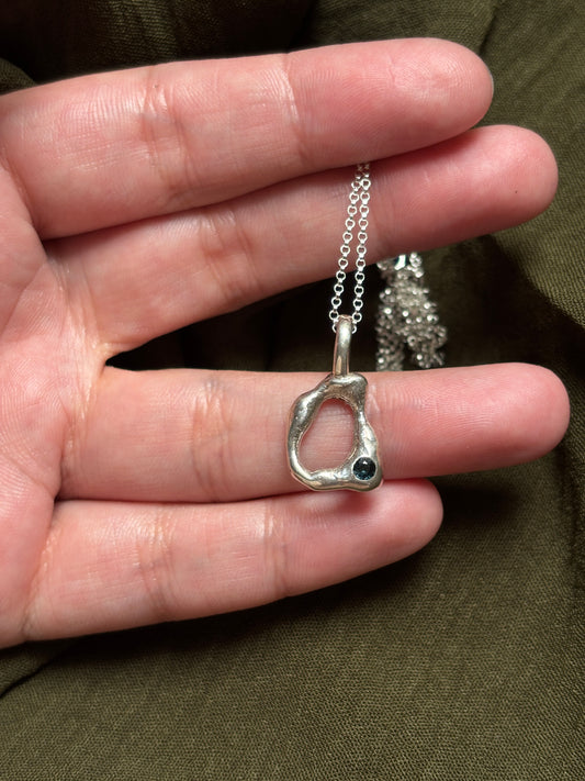 Molten pendant with sapphire